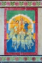 Surya, the Sun God, in a chariot drawn by seven horses on a Japanese Ceramic Tile painting in Shiva Mandir Kon