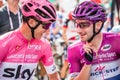 Susa, Italy May 26, 2018: Chris Froome in pink jersey and Elia Viviani in purple jersey speak in first