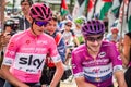 Susa, Italy May 26, 2018: Chris Froome in pink jersey and Elia Viviani in purple jersey speak in first