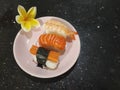 Sushi assorted plate on black granite table