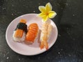 Sushi assorted plate on black granite table