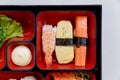 Sushi Bento Served with Japanese Rice Wraped with Seaweed and Shrimp, Kani and Tamagoyaki Sushi with Seaweed Salad. Royalty Free Stock Photo