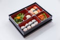 Sushi Bento Served with Japanese Rice Wraped with Seaweed and Shrimp, Kani and Tamagoyaki Sushi with Seaweed Salad. Royalty Free Stock Photo