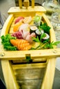Sushi boat with different types of sushi pieces in a Chinese/Japanese restaurant