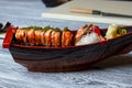 Sushi boat with shrimp.