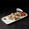 Sushi Bonito with salmon, cheese and tuna chips. Traditional Japanese sushi rolls. Royalty Free Stock Photo