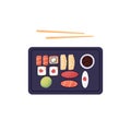 Sushi box, set with chopsticks. Japanese sea food with rice, red fish, tuna, salmon, caviar and nori. Japan rolls, maki Royalty Free Stock Photo