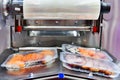 Sushi in boxes transfer on automated conveyor system