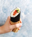 Sushi Burrito with salmon, cucumber, sweet pepper and cream cheese Royalty Free Stock Photo