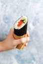 Sushi Burrito with salmon, cucumber, sweet pepper and cream cheese Royalty Free Stock Photo