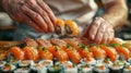 Sushi Chef Arranging a Platter of Freshly Made Sushi Rolls