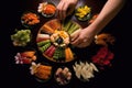 sushi chefs hands arranging plate