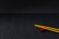 Sushi chopsticks on black bamboo straw mat Royalty Free Stock Photo