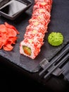 Sushi with chopsticks, ginger, soy sauce and wasabi. Japanese food. Set of sushi roll with vegetables, fish and caviar Royalty Free Stock Photo