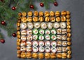Sushi on christmas background. Christmas tree with toys and sushi rolls set for menu and advertising. Christmas pattern with food Royalty Free Stock Photo