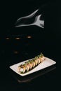 Sushi Chuka Roll on a black background