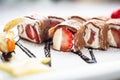 Sushi dessert creme cheese maki with strawberries