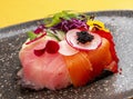 Sushi donut on a ceramic plate. Sushi trend. Creative food