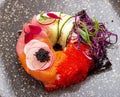 Sushi donut on a ceramic plate. Sushi trend. Creative food