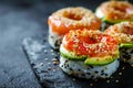 Sushi donuts on dark concrete table, japanese sushi made in shape of donuts, food mashup concept, copy space.