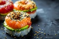 Sushi donuts on dark concrete table, japanese sushi made in shape of donuts, food mashup concept.