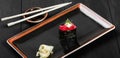 Sushi Gunkan maki with tuna on dark wooden background. Japanese cuisine. Top view. Royalty Free Stock Photo