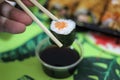Sushi hossomaki salmon chopstick soy sauce