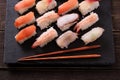 Sushi japanese food black slate platter chopsticks Royalty Free Stock Photo