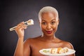 Sushi, Japanese food and portrait of woman with salmon, rice and chopsticks for eating a platter of fish, seafood or Royalty Free Stock Photo