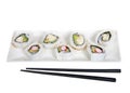 Sushi on a long plate with chop sticks, isolated