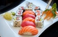 Sushi maki and California Roll with ginger and wasabi on a plate with chopsticks Royalty Free Stock Photo