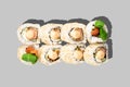 Sushi maki isolated on grey background. Spicy prawn roll. Japanese food. Restaurant menu. Close up, top view Royalty Free Stock Photo