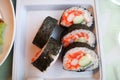 Sushi maki rice and seaweed with salmon Crab Stick and cucumber Royalty Free Stock Photo