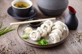 Sushi maki rolls California with crab, cucumber and avocado on a plate with chopsticks, soy sauce, wasabi and ginger Royalty Free Stock Photo