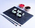 Sushi Maki rolls cucumber. Fresh hosomaki pieces with rice and nori. Close Up of delicious japanese food with sushi roll Royalty Free Stock Photo