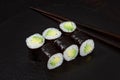 Sushi Maki rolls cucumber. Fresh hosomaki pieces with rice and nori. Close Up of delicious japanese food with sushi roll Royalty Free Stock Photo