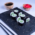 Sushi Maki rolls cucumber. Fresh hosomaki pieces with rice and nori. Close Up of delicious japanese food with sushi roll Royalty Free Stock Photo