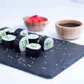 Sushi Maki rolls cucumber. Fresh hosomaki pieces with rice and nori. Close Up of delicious japanese food with sushi roll Royalty Free Stock Photo