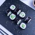 Sushi Maki rolls cucumber. Fresh hosomaki pieces with rice and nori. Close Up of delicious japanese food with sushi roll Royalty Free Stock Photo