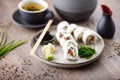 Sushi maki rolls Philadelphia with salmon, creamy cheese and avocado on a plate with chopsticks, soy sauce, wasabi and Royalty Free Stock Photo