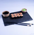 Sushi Maki rolls salmon. Fresh hosomaki pieces with rice and nori. Close Up of delicious japanese food with sushi roll Royalty Free Stock Photo