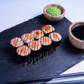 Sushi Maki rolls salmon. Fresh hosomaki pieces with rice and nori. Close Up of delicious japanese food with sushi roll Royalty Free Stock Photo