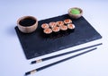 Sushi Maki rolls salmon. Fresh hosomaki pieces with rice and nori. Close Up of delicious japanese food with sushi roll Royalty Free Stock Photo