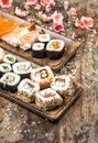 Sushi, maki, sashimi and sushi rolls. Spring flowers