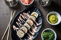 Sushi maki with tempura prawns, green salad