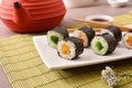 Sushi maki on white plate with oriental decoration front Royalty Free Stock Photo