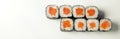 Sushi maki on a white plate. Sushi roll maki with salmon red fish. For the restaurant menu. Close-up. Place for Royalty Free Stock Photo