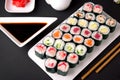 Sushi menu. Japanese food. Set of maki with salmon, tuna, chuka, cucumber, avocado, cheese, eel, shrimp, crab stick, tobiko caviar Royalty Free Stock Photo