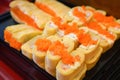 Sushi menu set Japanese cuisine fresh ingredients on tray - Japanese food sushi roll rice crab stick omelet with Tobiko egg is Royalty Free Stock Photo