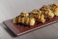 Sushi piece, brie cheese niguiri. closed image